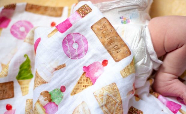 baby wearing the best pampers diapers for newborns